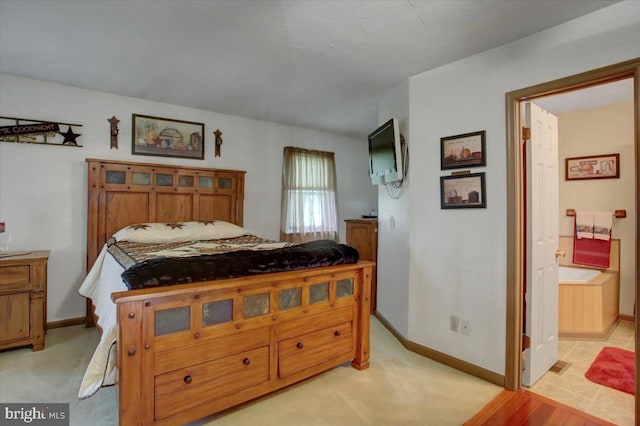 50 Valleyview Dr, Littlestown, PA 17340 - bedroom with baseboards, light carpet, and ensuite bath