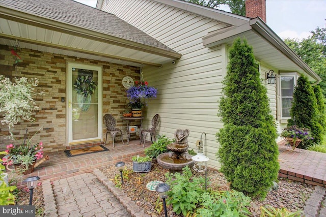 50 Valleyview Dr, Littlestown, PA 17340 - view of exterior entry with roof with shingles and a chimney