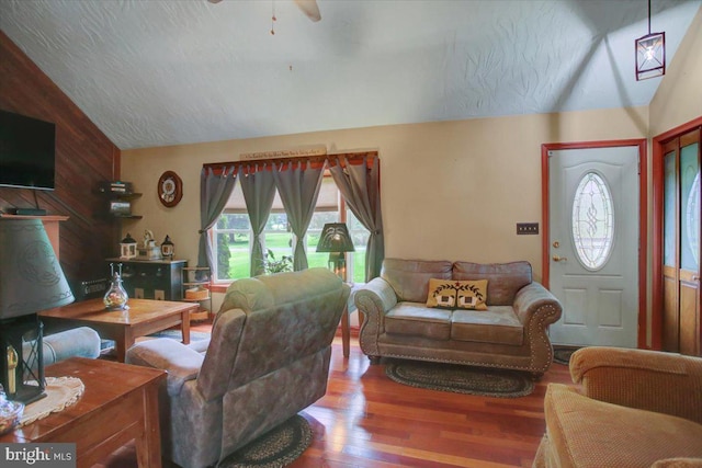 50 Valleyview Dr, Littlestown, PA 17340 - living room featuring vaulted ceiling, wood finished floors, ceiling fan, and wooden walls