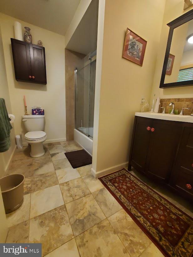 10 Stevens Ln, Tabernacle, NJ 08088 - bathroom featuring vanity, toilet, baseboards, and shower / bath combination with glass door