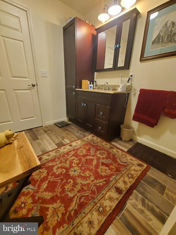 10 Stevens Ln, Tabernacle, NJ 08088 - bathroom with wood finished floors, vanity, and baseboards