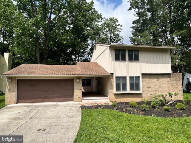 9001 Wetbanks Ct, Columbia, MD 21045 - view of front facade with brick siding, a garage, concrete driveway, and a front lawn