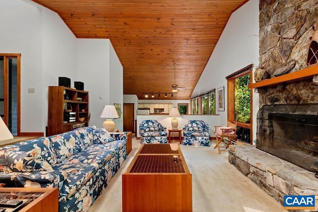98 Pedlars Pt, Roseland, VA 22967 - living area featuring wood ceiling, carpet flooring, a stone fireplace, rail lighting, and high vaulted ceiling