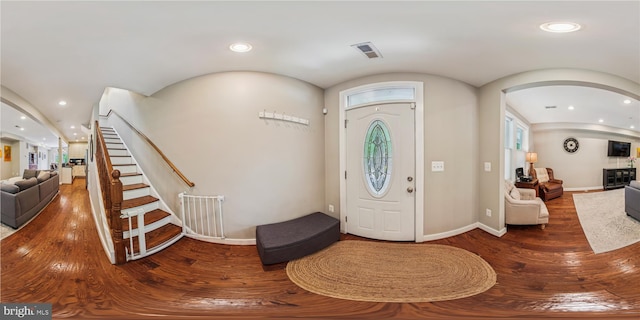 422 Hamilton St NW, Washington, DC 20011 - foyer entrance with wood finished floors, arched walkways, stairway, recessed lighting, and baseboards