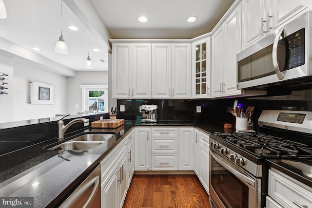 422 Hamilton St NW, Washington, DC 20011 - kitchen with stainless steel appliances, a sink, white cabinetry, and recessed lighting