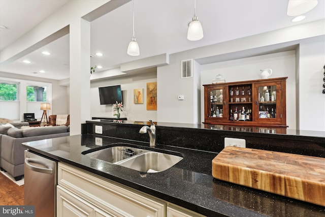 422 Hamilton St NW, Washington, DC 20011 - kitchen with a sink, dark stone countertops, open floor plan, hanging light fixtures, and recessed lighting