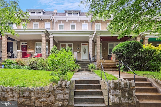 422 Hamilton St NW, Washington, DC 20011 - view of property with covered porch, stairway, brick siding, and mansard roof