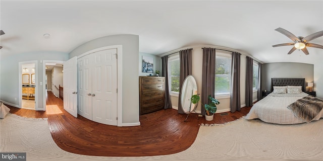 422 Hamilton St NW, Washington, DC 20011 - bedroom with wood finished floors, baseboards, lofted ceiling, a ceiling fan, and a closet