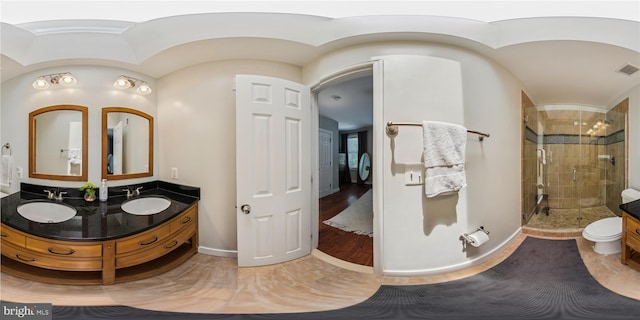 422 Hamilton St NW, Washington, DC 20011 - full bathroom featuring a shower stall, double vanity, and baseboards