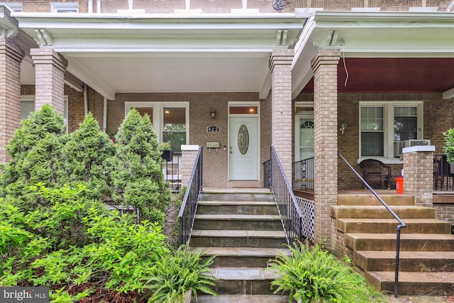 422 Hamilton St NW, Washington, DC 20011 - view of exterior entry with a porch and brick siding