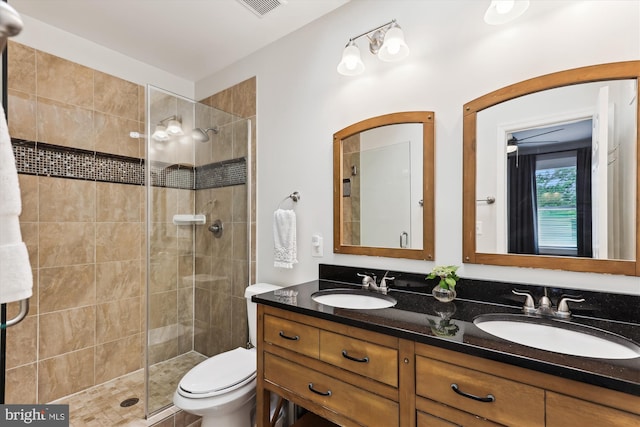 422 Hamilton St NW, Washington, DC 20011 - full bathroom featuring double vanity, a stall shower, and toilet
