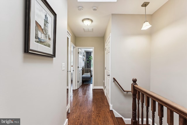 422 Hamilton St NW, Washington, DC 20011 - hall with an upstairs landing, dark wood-type flooring, and baseboards