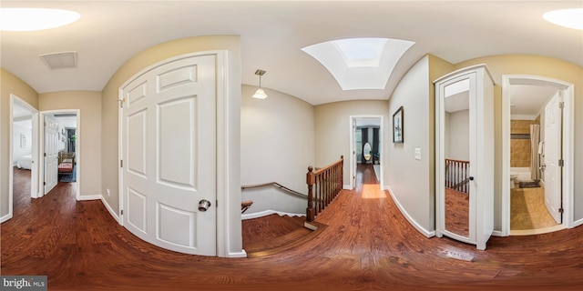422 Hamilton St NW, Washington, DC 20011 - corridor featuring an upstairs landing, dark wood finished floors, arched walkways, and baseboards