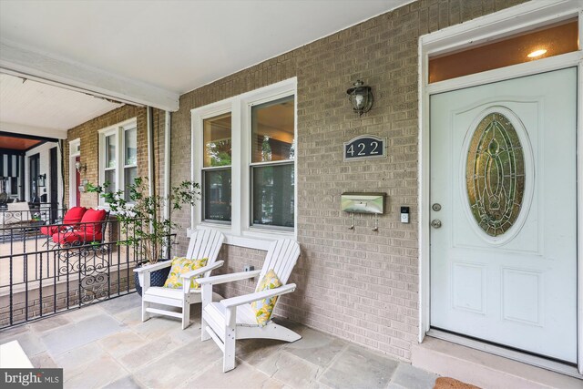 422 Hamilton St NW, Washington, DC 20011 - property entrance featuring covered porch and brick siding