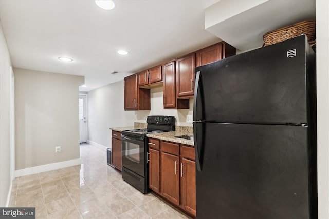 422 Hamilton St NW, Washington, DC 20011 - kitchen featuring black appliances, baseboards, recessed lighting, light stone counters, and light tile patterned flooring