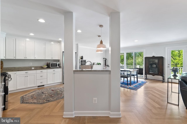 128 N Jay St, Middleburg, VA 20117 - kitchen with stainless steel appliances, white cabinets, baseboards, ornamental molding, and decorative light fixtures