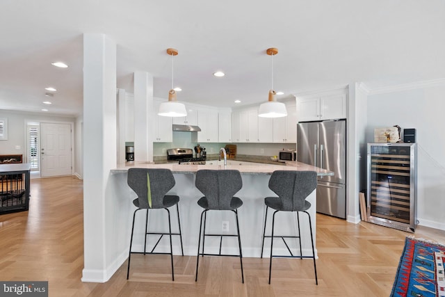 128 N Jay St, Middleburg, VA 20117 - kitchen featuring stainless steel appliances, beverage cooler, crown molding, white cabinetry, and recessed lighting