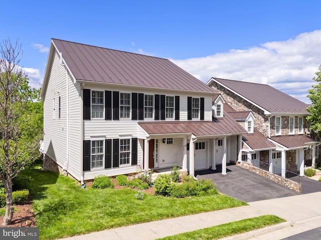 128 N Jay St, Middleburg, VA 20117 - view of front of house with a standing seam roof, asphalt driveway, a front yard, and metal roof