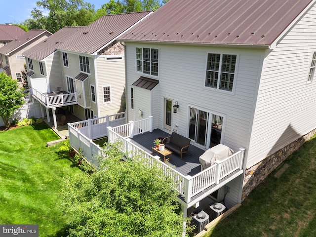 128 N Jay St, Middleburg, VA 20117 - back of property with a wooden deck, a yard, metal roof, and central air condition unit