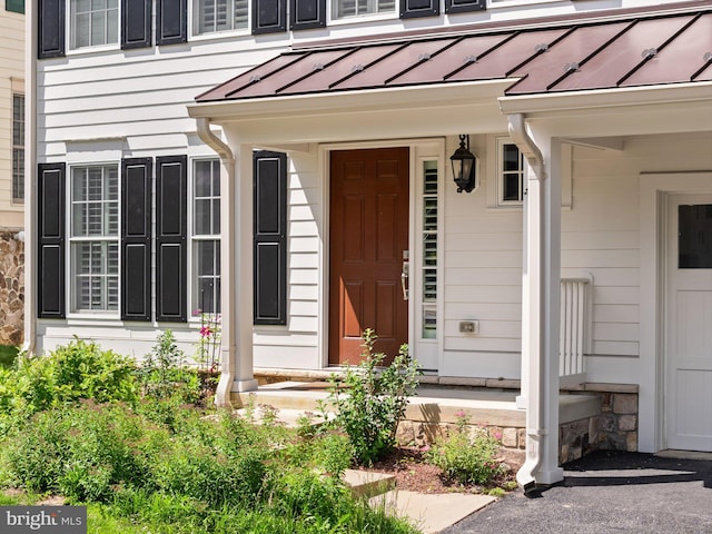 128 N Jay St, Middleburg, VA 20117 - view of exterior entry featuring a standing seam roof, metal roof, and a porch