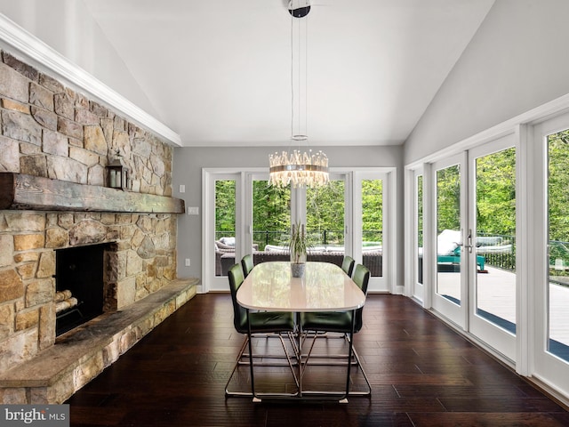 2762 Horseshoe Trl, Chester Springs, PA 19425 - dining space with high vaulted ceiling, french doors, a chandelier, a stone fireplace, and dark wood-style floors