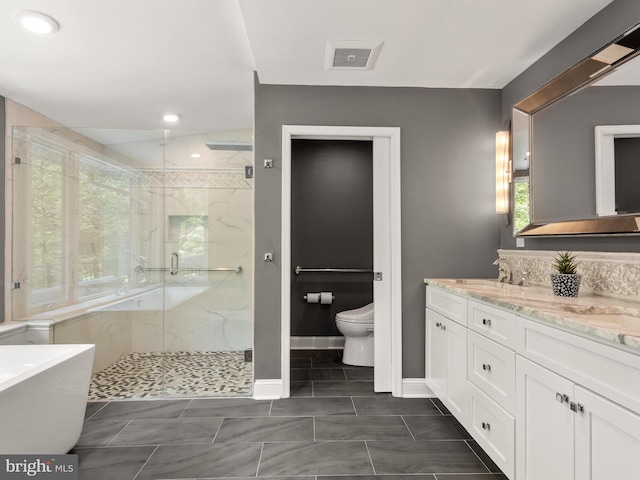 2762 Horseshoe Trl, Chester Springs, PA 19425 - bathroom featuring a marble finish shower, a freestanding tub, double vanity, and recessed lighting
