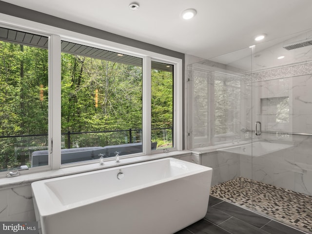 2762 Horseshoe Trl, Chester Springs, PA 19425 - full bath featuring healthy amount of natural light, a freestanding tub, a marble finish shower, and recessed lighting