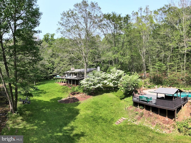 2762 Horseshoe Trl, Chester Springs, PA 19425 - view of grassy yard featuring a deck and a forest view