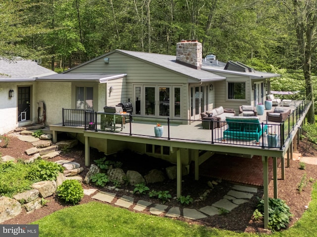 2762 Horseshoe Trl, Chester Springs, PA 19425 - rear view of property featuring a wooden deck, a chimney, outdoor lounge area, and a view of trees