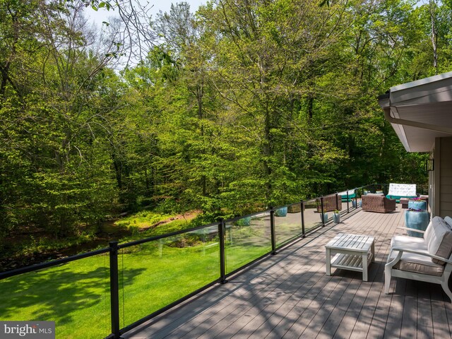 2762 Horseshoe Trl, Chester Springs, PA 19425 - wooden deck with an outdoor hangout area, a yard, and a forest view