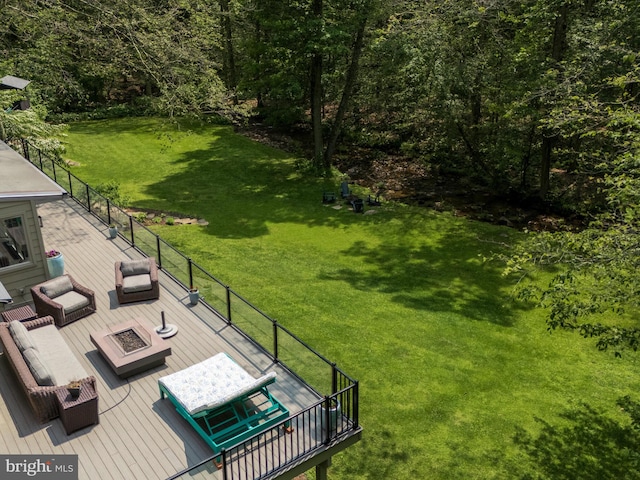 2762 Horseshoe Trl, Chester Springs, PA 19425 - view of green lawn with a wooden deck and an outdoor living space with a fire pit