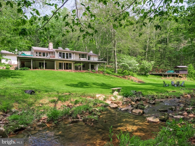 2762 Horseshoe Trl, Chester Springs, PA 19425 - view of grassy yard featuring a view of trees and a deck