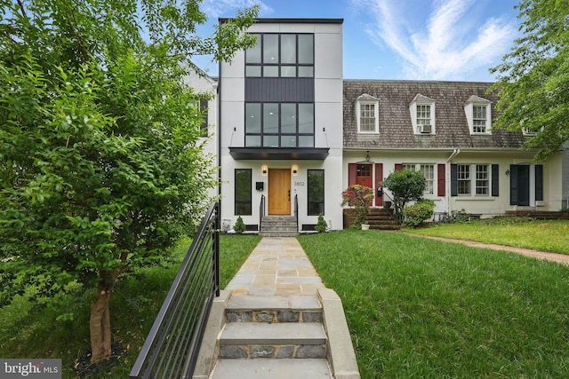 3802 T St NW, Washington, DC 20007 - view of front of house featuring a front lawn and stucco siding