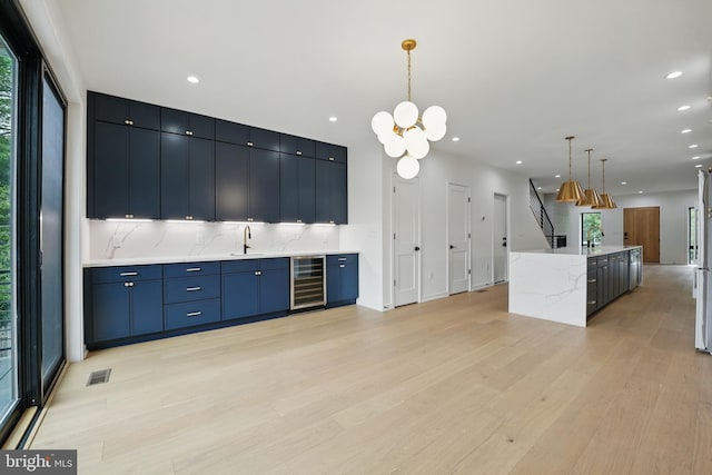 3802 T St NW, Washington, DC 20007 - kitchen with beverage cooler, light wood finished floors, tasteful backsplash, recessed lighting, and a sink
