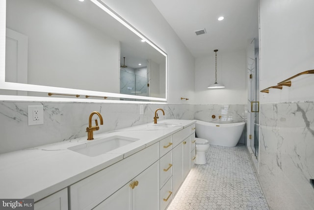 3802 T St NW, Washington, DC 20007 - bathroom with tile walls, a marble finish shower, double vanity, a soaking tub, and a wainscoted wall