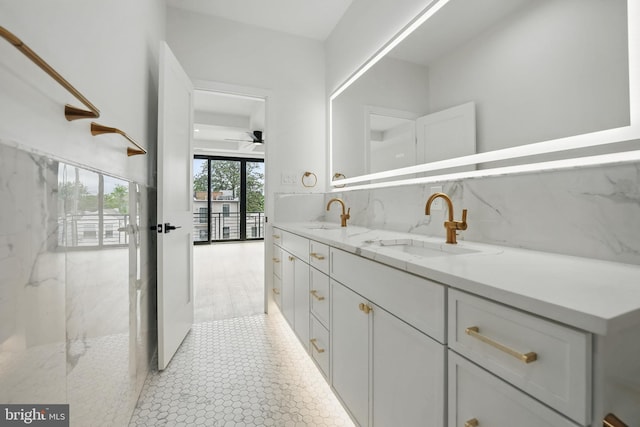 3802 T St NW, Washington, DC 20007 - bathroom featuring double vanity, decorative backsplash, and ceiling fan