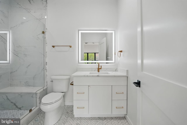 3802 T St NW, Washington, DC 20007 - full bath with vanity, toilet, a marble finish shower, and baseboards