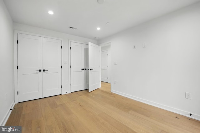 3802 T St NW, Washington, DC 20007 - unfurnished bedroom featuring multiple closets, light wood-type flooring, baseboards, and recessed lighting