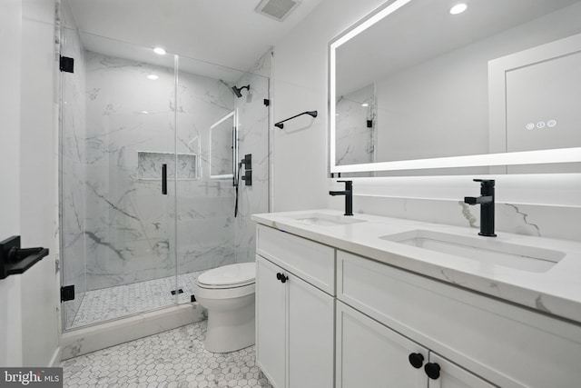 3802 T St NW, Washington, DC 20007 - bathroom with double vanity, toilet, recessed lighting, and a marble finish shower