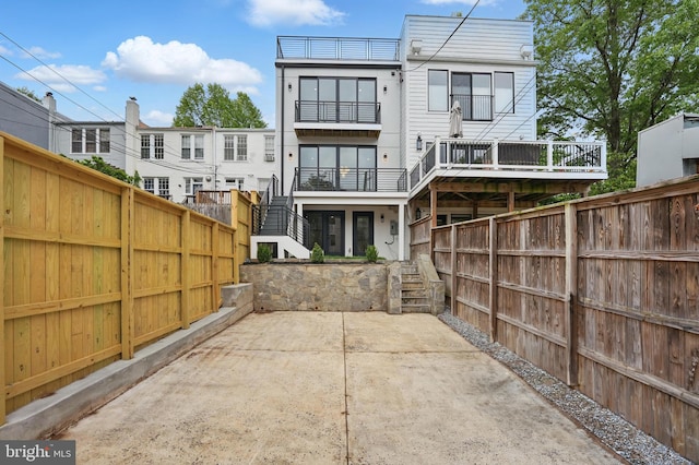 3802 T St NW, Washington, DC 20007 - rear view of house featuring a fenced backyard and stairs