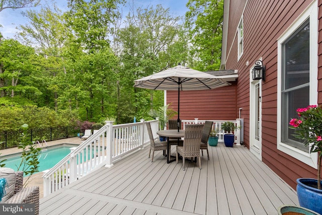 10108 Rockinghorse Ln, Spotsylvania, VA 22553 - wooden deck with outdoor dining space and view of wooded area