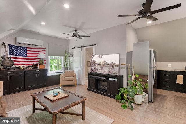 10108 Rockinghorse Ln, Spotsylvania, VA 22553 - living area featuring ceiling fan, a wall unit AC, a barn door, lofted ceiling, and light wood-style floors
