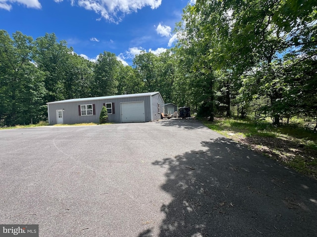 1037 Raven Rocks Rd, Springfield, WV 26763 - view of front facade featuring asphalt driveway and an outdoor structure