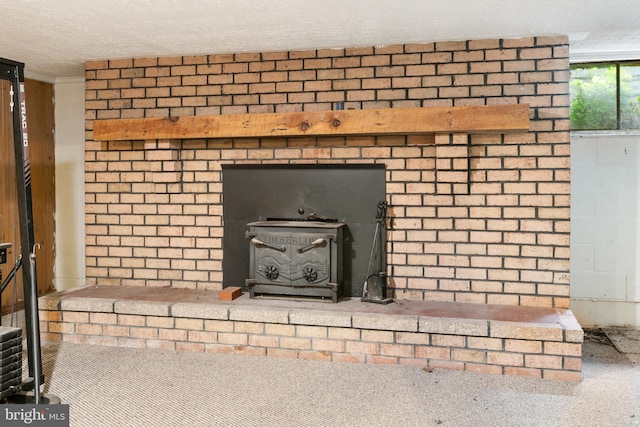 52 Golden Maple Ln, Maurertown, VA 22644 - detailed view of a wood stove, a textured ceiling, and carpet flooring