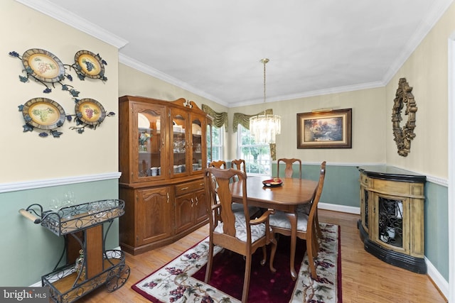 201 Forge Rd, Collegeville, PA 19426 - dining space featuring a chandelier, light wood finished floors, and ornamental molding