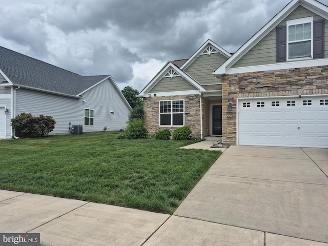 226 N Red Haven Ln, Dover, DE 19901 - craftsman-style house with stone siding, concrete driveway, a front yard, and cooling unit