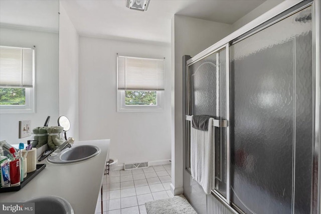 17 Bermuda Ave, Bridgeton, NJ 08302 - bathroom with plenty of natural light, an enclosed shower, tile patterned flooring, and double vanity