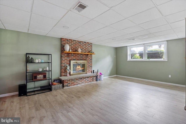 17 Bermuda Ave, Bridgeton, NJ 08302 - living room with a drop ceiling, a fireplace, wood finished floors, and baseboards