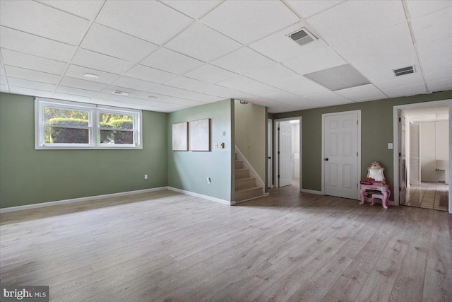 17 Bermuda Ave, Bridgeton, NJ 08302 - empty room with a paneled ceiling, stairway, wood finished floors, and baseboards