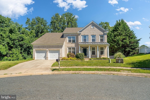 1903 Scottish Isle Ct, Abingdon, MD 21009 - view of front facade with an attached garage, a front lawn, concrete driveway, a porch, and brick siding